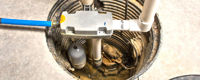 Dealing with a Scarborough Drain Clog - What NOT to Do 5 a sump pit in the basement of a Scarborough home with a sump pump installed in the bottom