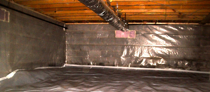 crawl space underneath a toronto home after being waterproofed using a special foundation waterproofing barrier