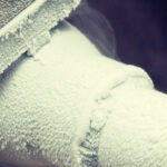 frozen pipe in the basement of a toronto home before being thawed, ice crystals are clearly visible on the exterior of the pipe